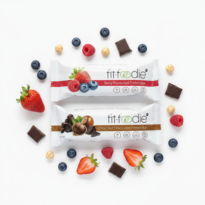 Mixed Choc Nut and Berry Protein Bars flat-lay with fruit and hazelnuts