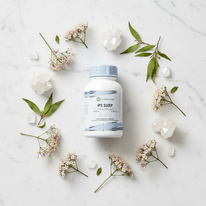 IPS Sleep bottle with ingredients flat lay on marble surface